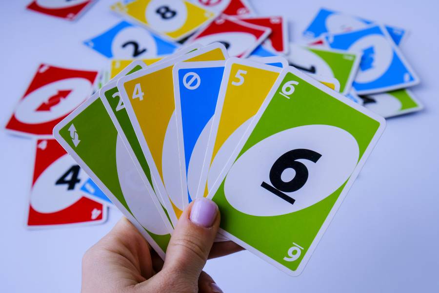 Uno cards being held by a hand