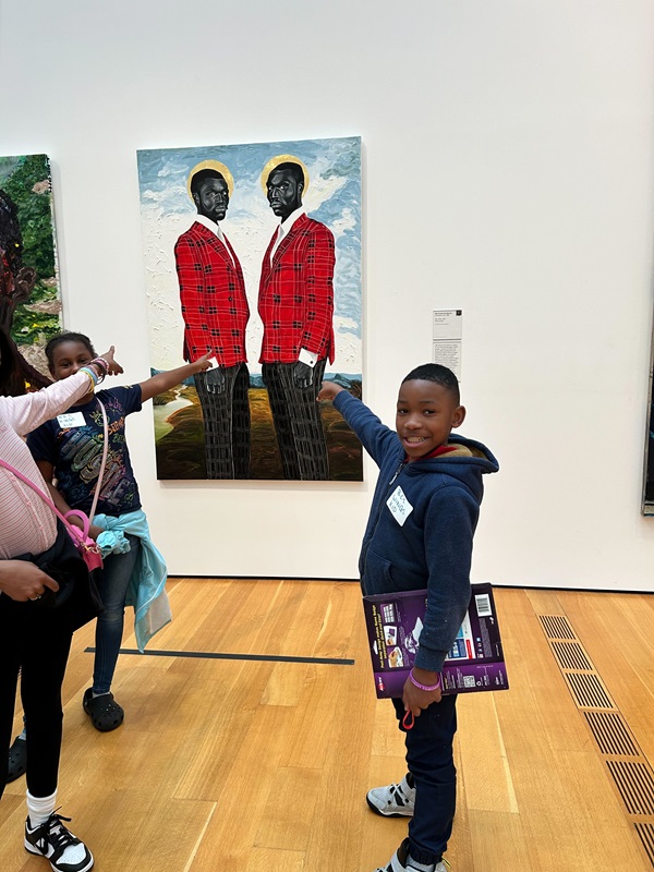 Students point to artwork